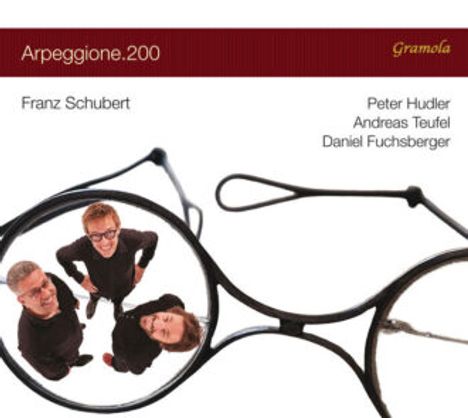 "Arpeggione.200", "Franz Schubert", "Peter Hudler", "Andreas Teufel", "Daniel Fuchsberger". Drei Personen durch Brille sichtbar.