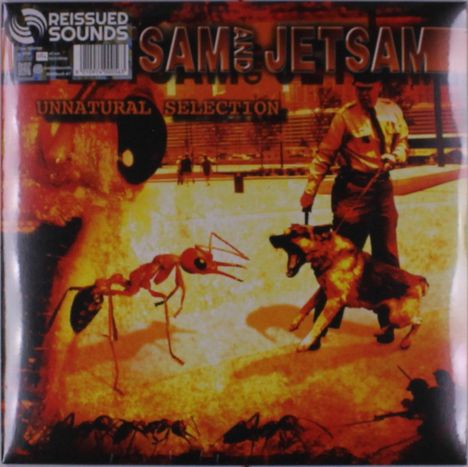 "UNNATURAL SELECTION, REISSUED SOUNDS, SAM AND JETSAM". Eine große Ameise steht einem knurrenden Hund gegenüber.