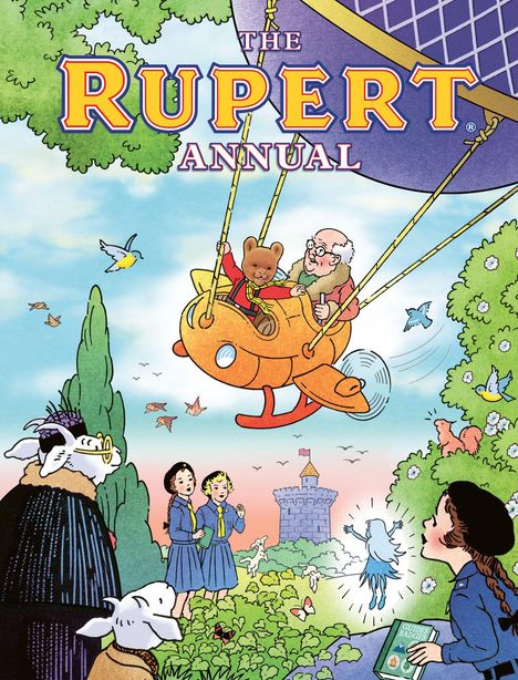 "THE RUPERT ANNUAL" ist oben in großen Buchstaben geschrieben. Eine Illustration zeigt einen Bären im Ballon, Mädchen und Tiere.