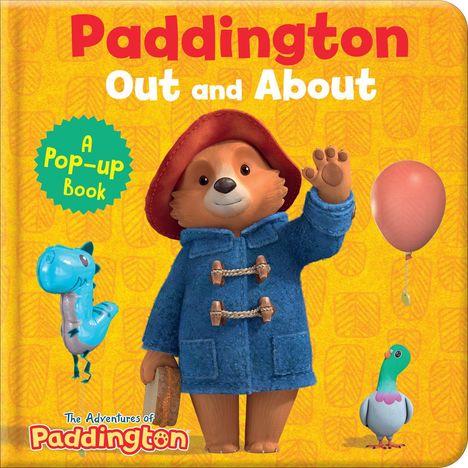 "Paddington Out and About. A Pop-up Book." Illustration eines Bären in blauem Mantel und rotem Hut mit Ballon und Taube.