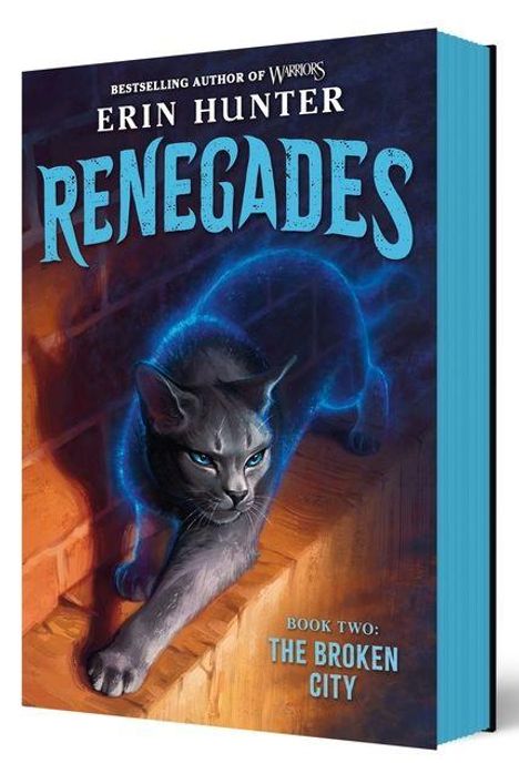 Text: "Bestelling Author of Warriors Erin Hunter Renegades Book Two: The Broken City". Illustration einer Katze mit blauem Licht.