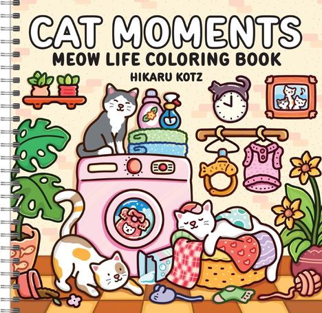 Ein Spiralblock zeigt "Cat Moments: Meow Life Coloring Book" von Hikaru Kotz. Drei Katzen und bunte Wäsche um eine Waschmaschine.