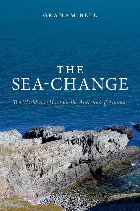 Text: “Graham Bell, The Sea-Change, The Worldwide Hunt for the Ancestors of Animals.” Klippen am Meer bei ruhigem Wasser.