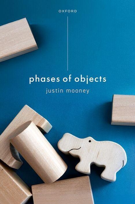 Text: "phases of objects" und "justin mooney". Holzklötze und ein Holzflusspferd liegen auf blauem Hintergrund.