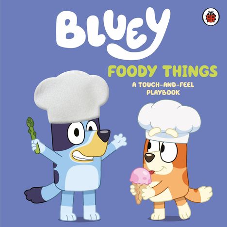 "BLUEY" oben, "FOODY THINGS" mittig. Zwei Hunde in Kochmützen, einer hält Spargel, der andere ein Eis.