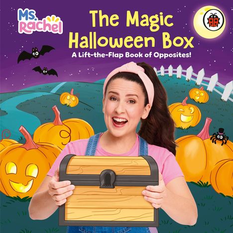 Text: "The Magic Halloween Box", "Ms. Rachel", "A Lift-the-Flap Book of Opposites". Frau hält eine Holzkiste, umgeben von Kürbissen.