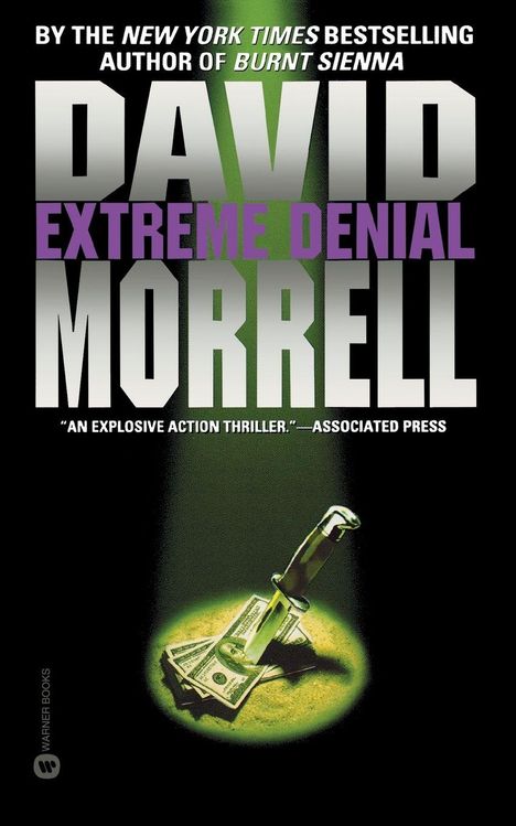 Text: "David Morrell, Extreme Denial, an explosive action thriller." Illustration: Messer steckt in Geldscheinen, grün beleuchtet.