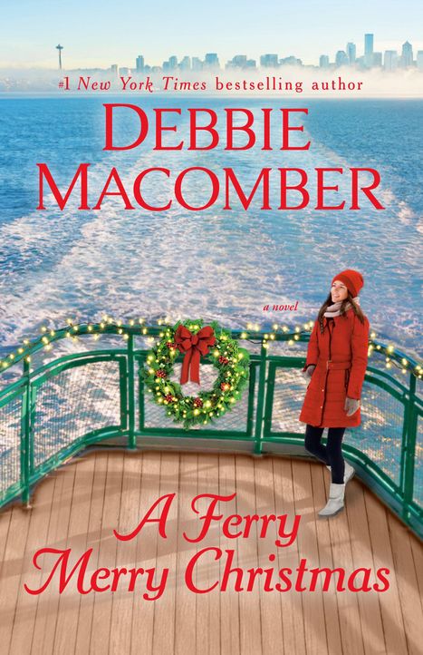 „DEBBIE MACOMBER, A Ferry Merry Christmas“. Eine Frau in einem roten Mantel steht auf einer Fähre mit einem Kranz.