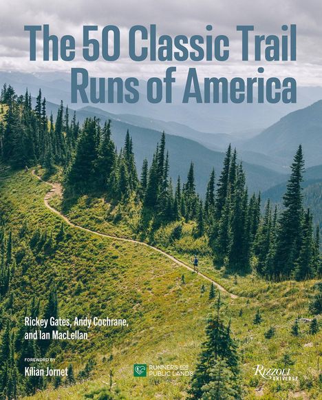 "The 50 Classic Trail Runs of America." Ein verschlungener Pfad führt durch eine bergige, grüne Landschaft mit Tannen.