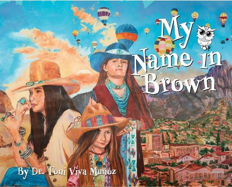 "My Name in Brown" steht groß. Eine Frau mit zwei Kindern, alle in bunter Kleidung und Hüten, vor einer Landschaft mit Heißluftballons.