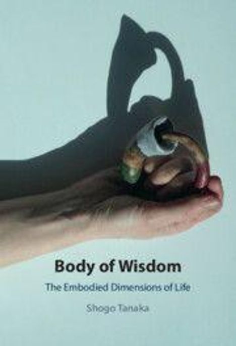 „Body of Wisdom: The Embodied Dimensions of Life“ von Shogo Tanaka. Eine Hand hält ein Objekt mit Schattenwurf.