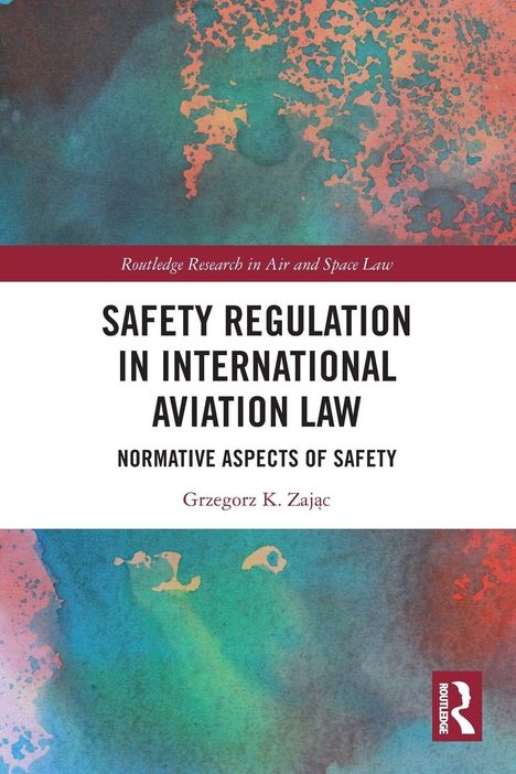 "Safety Regulation in International Aviation Law" von Grzegorz K. Zając. Farbige abstrakte Muster, Logo unten rechts.