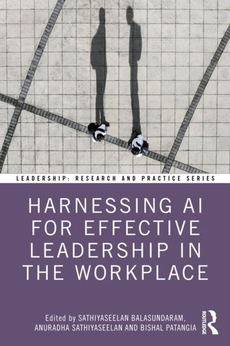HARNESSING AI FOR EFFECTIVE LEADERSHIP IN THE WORKPLACE. Zwei Personen von oben, ihre langen Schatten kreuzen sich.