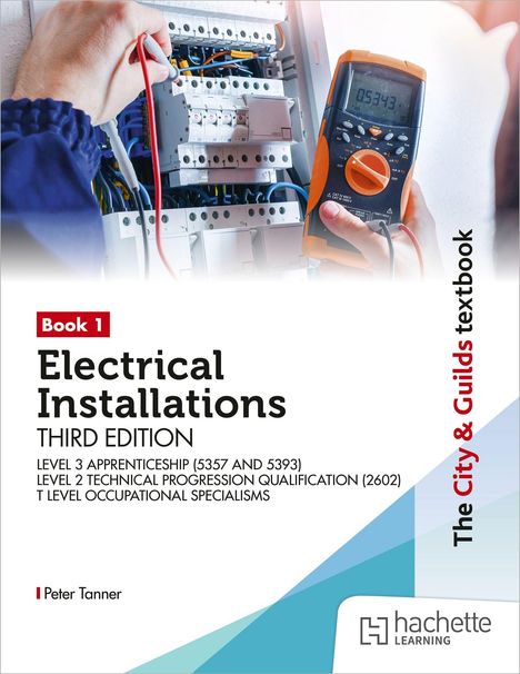 "Book 1, Electrical Installations, Third Edition" steht auf weißem Hintergrund. Eine Hand hält ein Messgerät an einem Schaltschrank.
