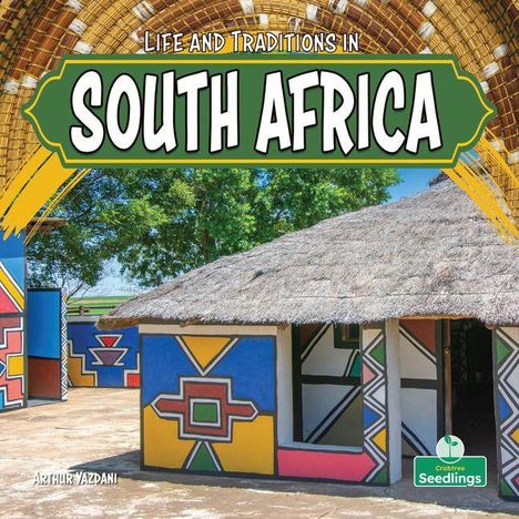 „Life and Traditions in South Africa“. Strohdachhaus mit farbenfrohen Mustern umgeben von grünen Bäumen.