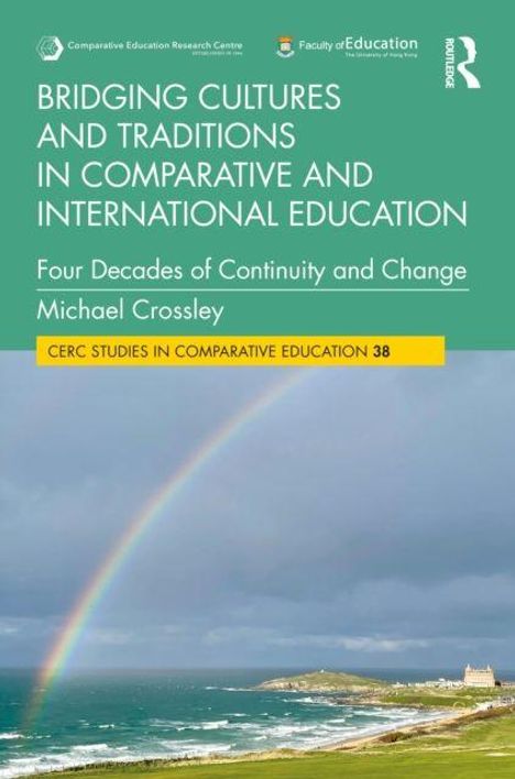 Buchtitel: „Bridging Cultures and Traditions in Comparative and International Education“ von Michael Crossley. Regenbogen über Küste.