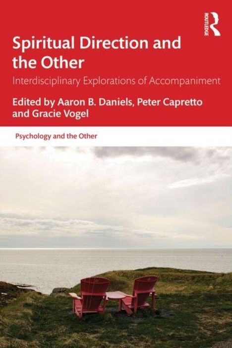 Oben steht „Spiritual Direction and the Other“. Zwei rote Stühle und ein Tisch in einer grasbewachsenen Landschaft.