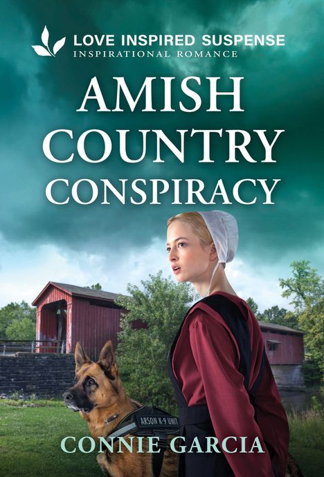 Text: "AMISH COUNTRY CONSPIRACY" von Connie Garcia. Eine Frau in traditioneller Kleidung mit einem Deutschen Schäferhund.