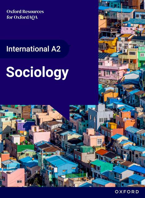 „International A2 Sociology“. Bunte Häuser in dicht besiedeltem Gebiet, mit vielfältigen Farben und architektonischen Stilen.