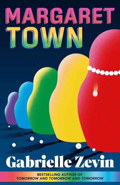 Text: "MARGARET TOWN", "Gabrielle Zevin". Illustration von bunten Matroschka-Puppen in einer Reihe.