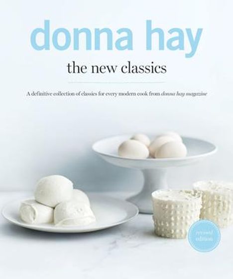 Text: "donna hay the new classics" und "A definitive collection of classics for every modern cook from donna hay magazine".  
Sahne, Eier, weißer Tisch.