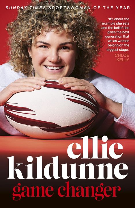 Oben steht "Cover to be revealed". Darunter "ELLIE KILDUNNE GAME CHANGER" in großen Buchstaben auf rotem Hintergrund.
