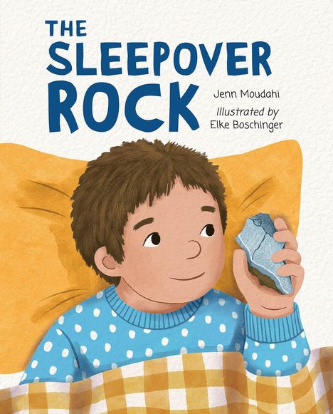 „THE SLEEPOVER ROCK“ steht groß darüber. Ein Junge im blauen Pullover hält einen Stein, lächelnd im Bett.