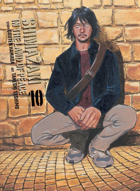 Cover: "Shiwazaki in the Land of Peace", Story: Gouto Hamada, Art: Takeshi Seshimo. Mann mit langer Jacke sitzt vor einer Ziegelwand.