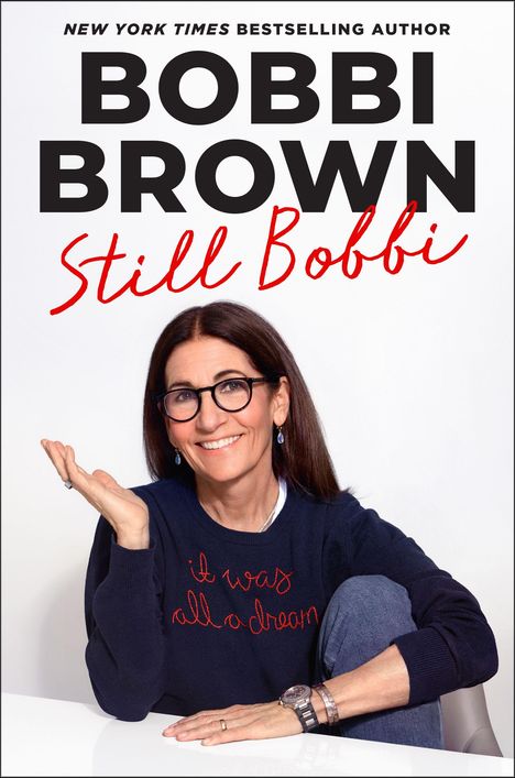 "New York Times Bestselling Author" oben, "BOBBI BROWN Still Bobbi" groß geschrieben. Frau sitzt lächelnd in legerer Kleidung.