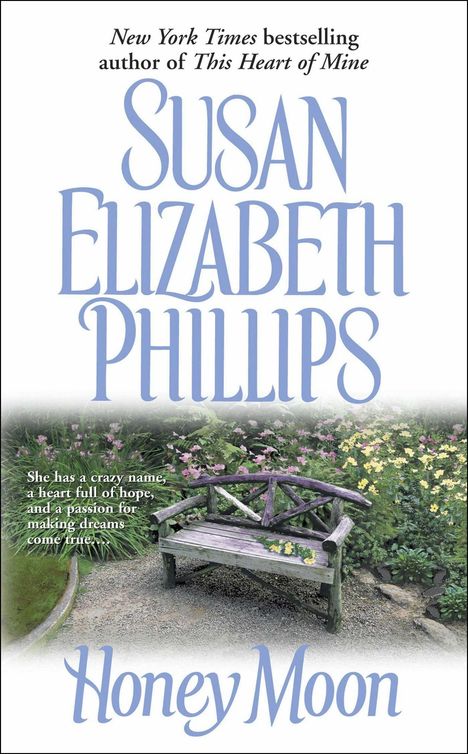 Texte: "New York Times bestselling author of This Heart of Mine", "Susan Elizabeth Phillips", "Honey Moon". 

Eine hölzerne Bank steht in einem blühenden Garten.