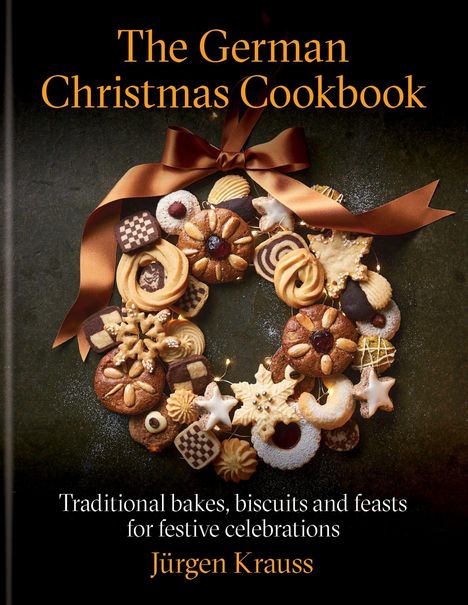 "The German Christmas Cookbook" auf einem Kranz aus Plätzchen mit einer braunen Schleife, Name "Jürgen Krauss" unten.