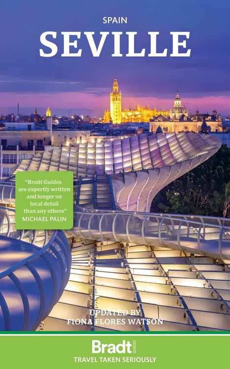 „Seville, Spain“ steht oben. Zitat über Reiseführerqualität. Abendaufnahme einer modernen Struktur und erleuchteter Stadt.