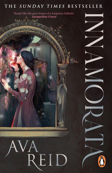 „THE SUNDAY TIMES BESTSELLER“, „INNAMORATA“, „AVA REID“. Eine Frau riecht an Blumen in einem gemalten, dekorativen Rahmen.