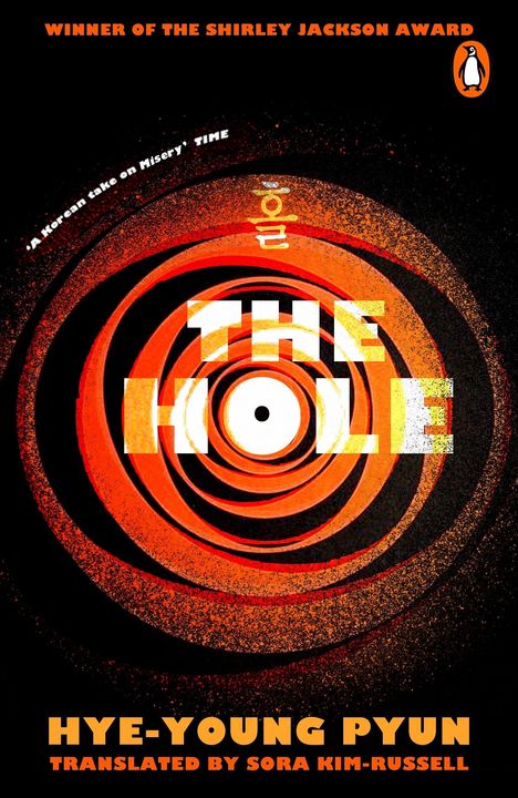 "THE HOLE" in weißen Buchstaben, oranges, spiralförmiges Muster, Logo eines Pinguins rechts oben.