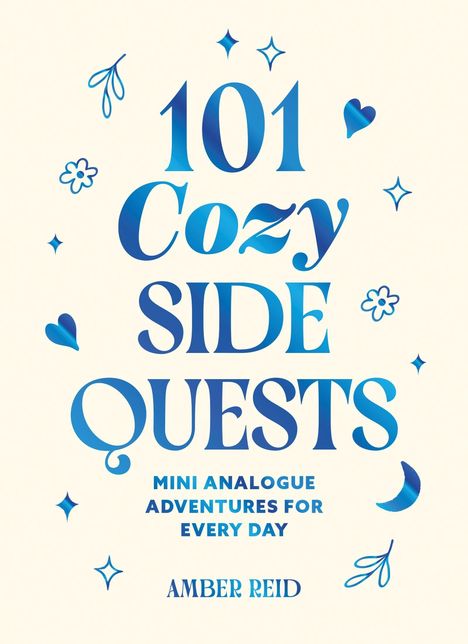 „101 Cozy Side Quests: Mini Analogue Adventures for Every Day“ von Amber Reid. Verspielte blaue Dekorationen.