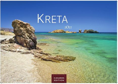 Text: "KRETA 2027". Eine felsige Küstenlandschaft mit klarem, türkisfarbenem Wasser und blauem Himmel.