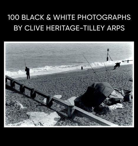 "100 Black & White Photographs by Clive Heritage-Tilley ARPS." Kiesstrand mit Anglern und Wellen im Hintergrund.