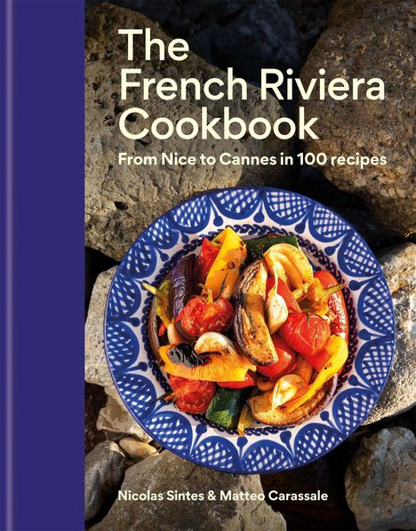 „The French Riviera Cookbook. From Nice to Cannes in 100 recipes.“ Ein Teller mit buntem Gemüse auf Steinboden.