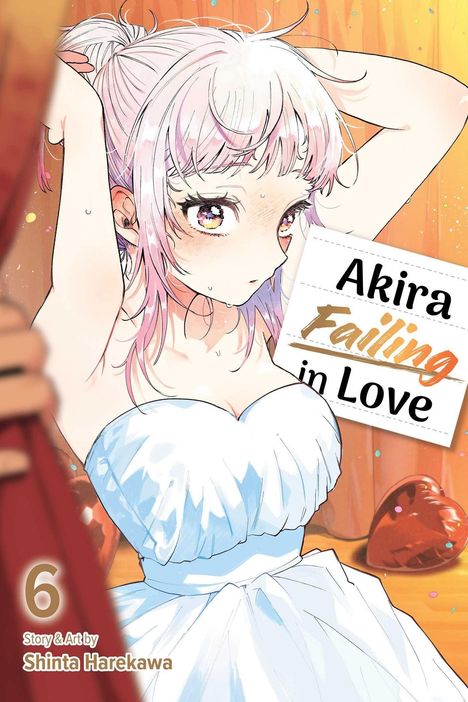 „Akira Falling in Love“ steht auf einem Papier. Eine Illustration zeigt ein Mädchen mit rosa Haaren in einem weißen Kleid. 