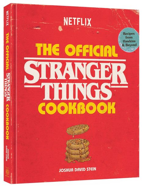 "THE OFFICIAL STRANGER THINGS COOKBOOK", roter Hintergrund, Waffeln mit Sirup abgebildet.