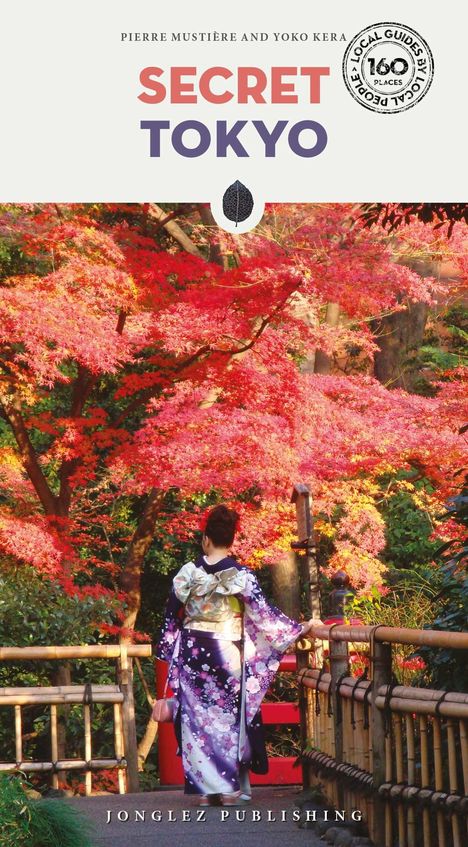 „SECRET TOKYO“ steht groß in der Mitte. Eine Person im Kimono vor herbstlich leuchtend roten Bäumen auf einer Brücke.