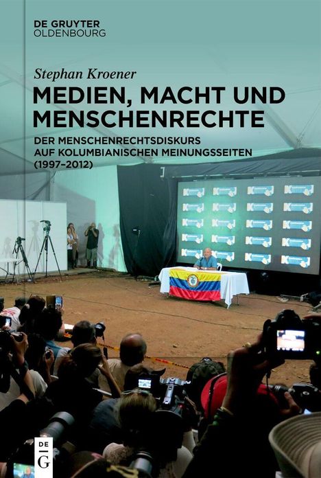 "Medien, Macht und Menschenrechte" von Stephan Kroener. Pressekonferenz mit kolumbianischer Flagge und vielen Fotografen.