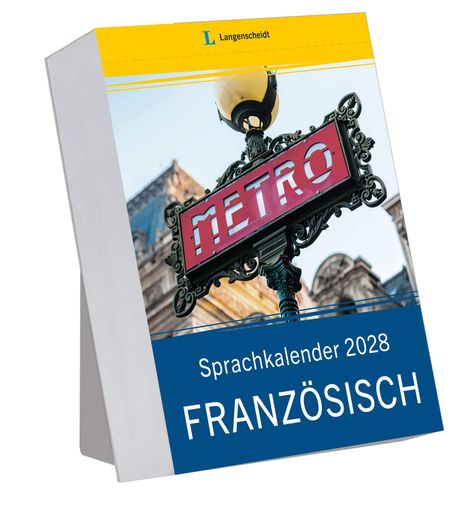 Text: "Sprachkalender 2028 FRANZÖSISCH", "Langenscheidt", "METRO". Ein markanter Metroschild vor historischem Gebäude.
