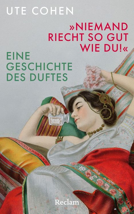 Text: „UTE COHEN“, „NIEMAND RIECHT SO GUT WIE DU!“, „EINE GESCHICHTE DES DUFTES“. Frau in einem Bett mit Flakon.
