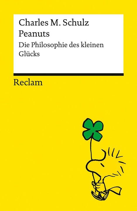 Text: "Charles M. Schulz Peanuts Die Philosophie des kleinen Glücks Reclam". Illustration: Vogel hält Kleeblatt, gelber Hintergrund.