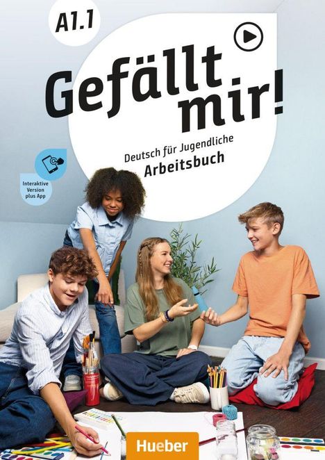 "A1.1 Gefällt mir! Deutsch für Jugendliche Arbeitsbuch. Vier Jugendliche arbeiten lächelnd an einem Tischprojekt."