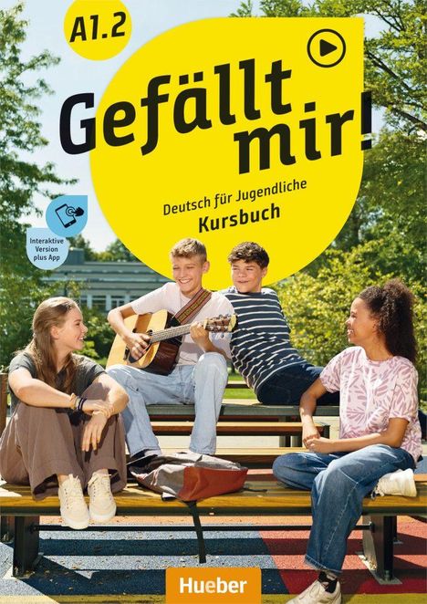 Text: "A1.2 Gefällt mir! Deutsch für Jugendliche Kursbuch, Interaktive Version plus App, Hueber". Vier Jugendliche sitzen draußen auf Bänken.