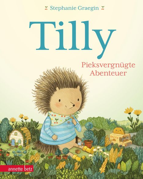 "Tilly: Pieksvergnügte Abenteuer" von Stephanie Graegin. Illustration: Ein Igel in Kleidung auf einer bunten Wiese.