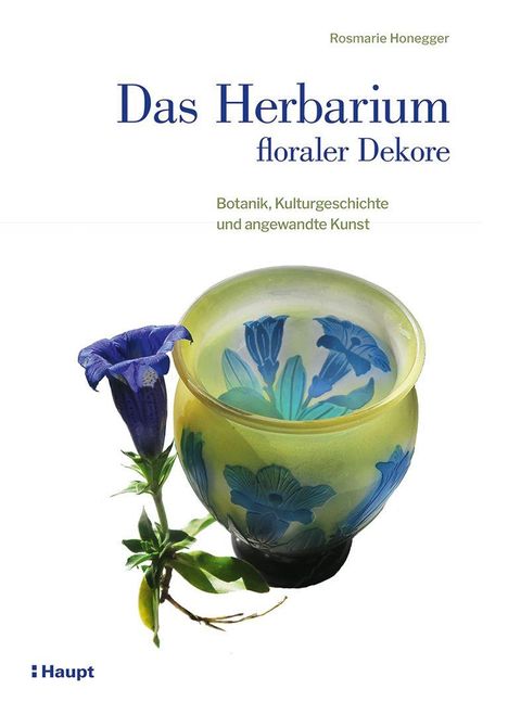 „Das Herbarium floraler Dekore“ von Rosmarie Honegger; gelbe Vase mit blauen Blumenmustern, daneben blaue Blume.