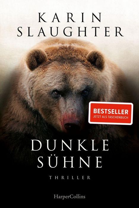 „Karin Slaughter. Dunkle Sühne. Thriller.“ Ein großes, nahes Bärenportrait, teils dunkel. Bestseller-Aufkleber.